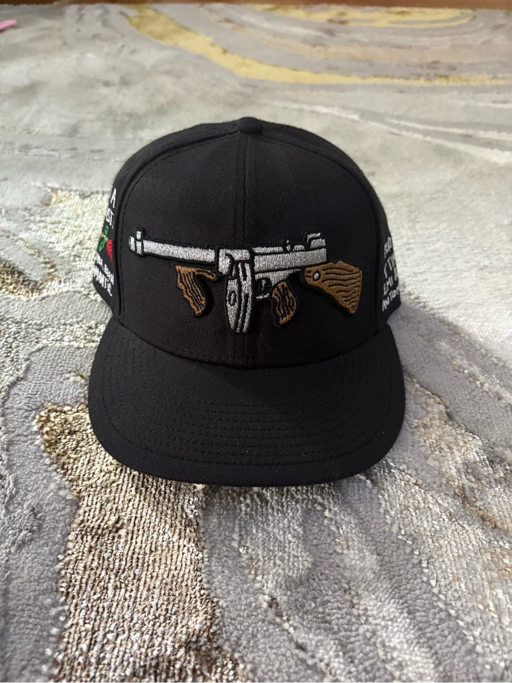 Black Embroidered Snapback Hat with Wood-Grain Gun Design